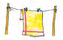 A wet towel is hung on a clothesline for drying.