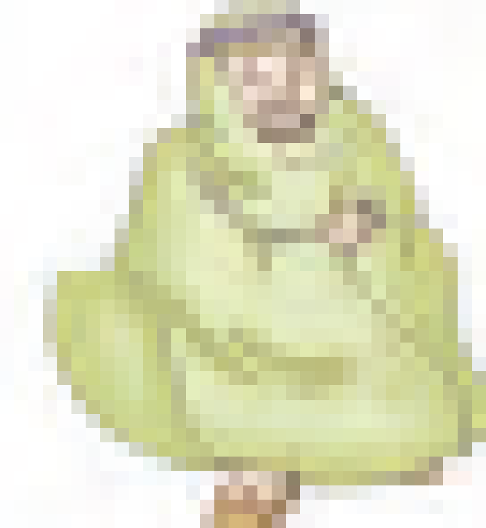 An Arab man who is all covered with clothes and his head is covered too.