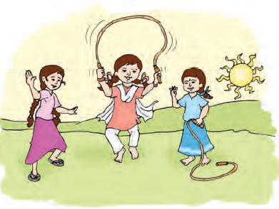 The girl is skipping a rope. Two more girls are playing with her.