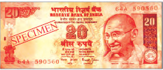 A twenty rupee note, it is rectangular in shape. It has pictures of Mahatma Gandhi, our national emblem and in the middle, number twenty is written.