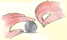 A coin kept vertically in a standing position.