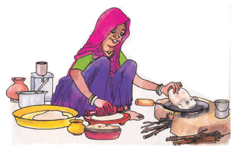 औरत चूल्हे पर रोटी बना रही है। 