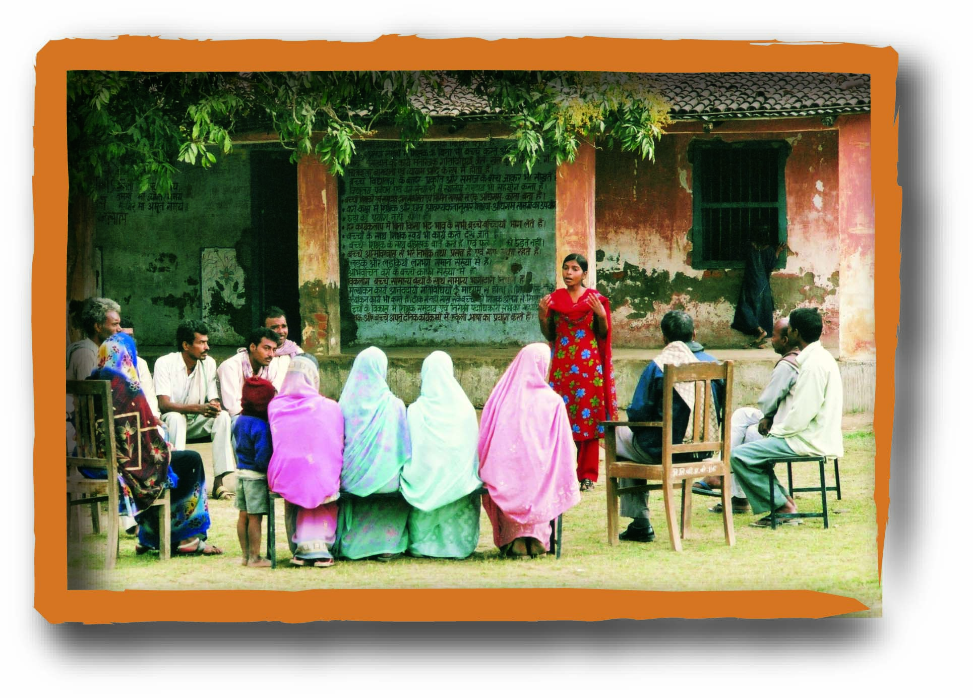 A lady conducting meeting in a village.