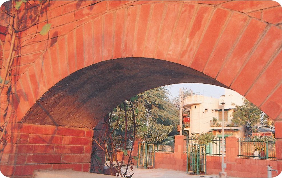 An arch under a bridge.