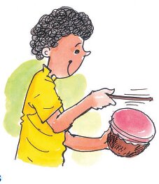 लड़का नारियल का नगाड़ा बनाकर बजा रहा है 