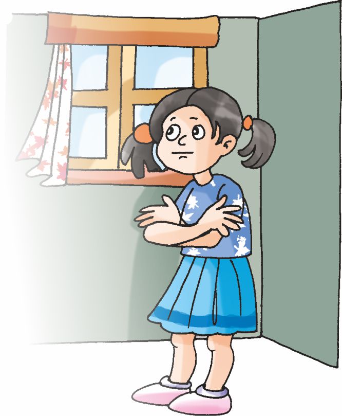 A girl is standing with her arms folded.