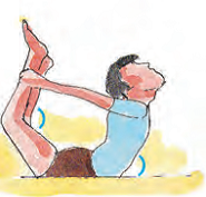 The boy is lying upside down on the mat such that he is looking up and holds his ankles with his hands.