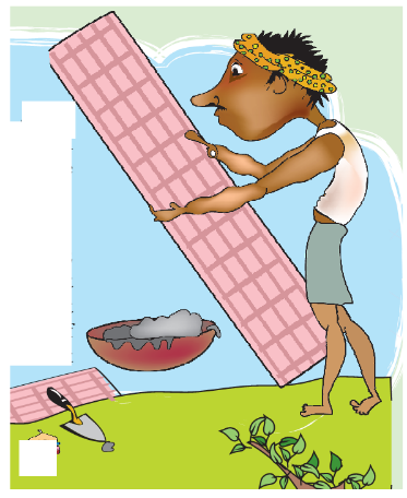 A man is putting rectangular tiles on a path.