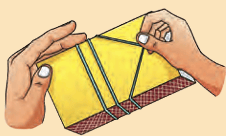 Hands playing a homemade rubber band guitar