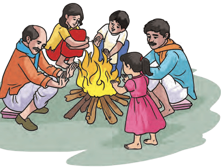 Family cooking over a wood fire outdoors