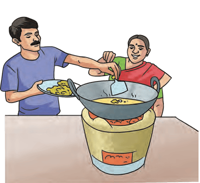 Person cooking on a traditional indoor stove