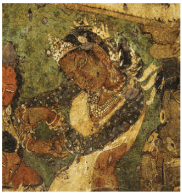 Dotted cloth draped over the woman's upper body is believed to be Bandhani