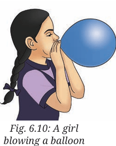 girl blowing a ballon