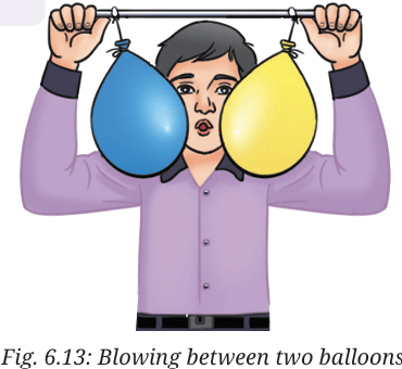 blowing between two ballons