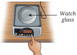 Fig. 9.12(b): Tare the balance
after placing a watch glass
