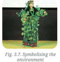 Actor in a leafy green costume symbolising the environment