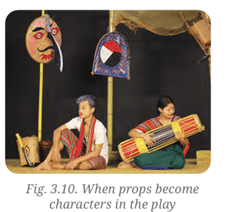 Actors performing with traditional props