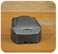 Side profile view of a boundary foot microphone resting on a surface.