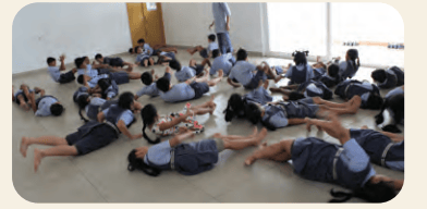 Students participating in a floor-based workshop activity